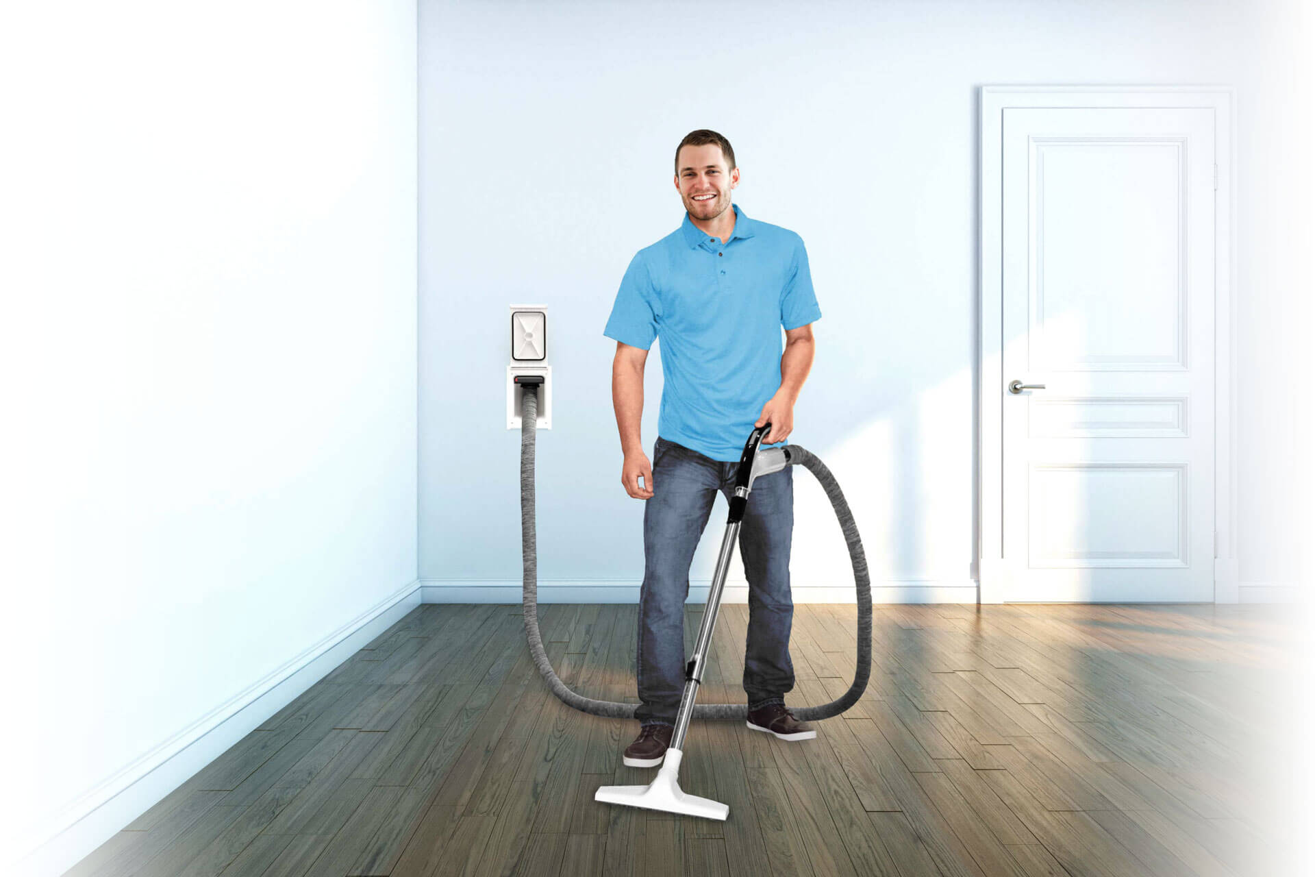 Man cleaning house with retraflex retractable hose system for central vacuums